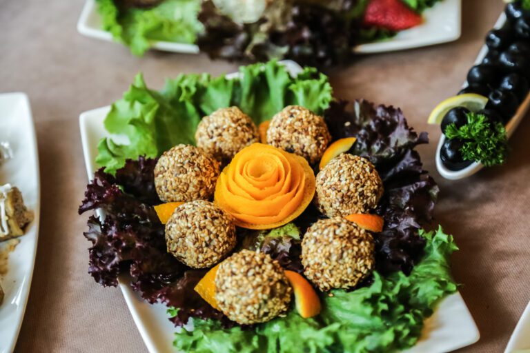 sesame balls lettucec orange olives side view