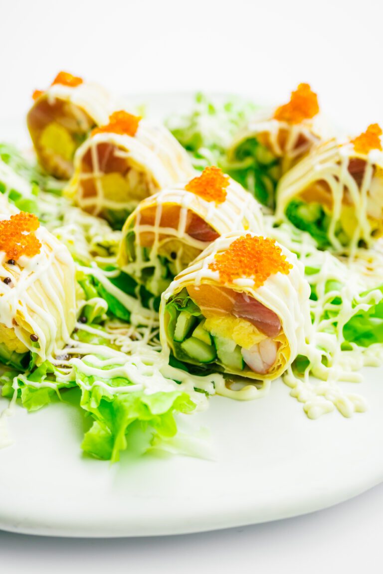 Sushi roll with tuna salmon and sweet egg inside on white plate - Color Filter Processing , Japanese food style